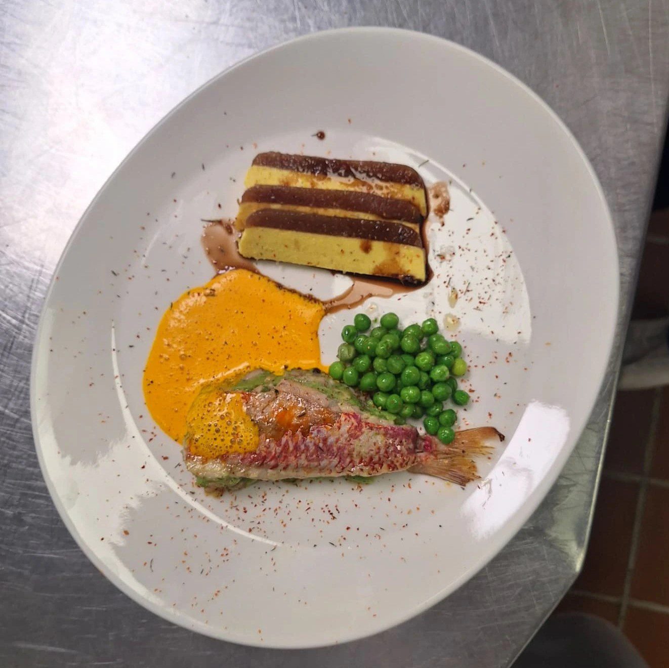 Red Mullet Stuffed Baby Octopus With Herb Butter Peas & Saffron Sauce